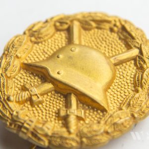 Wound Badge 1918 in gold  Counter-relief    Set with dress miniature