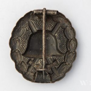 Wound Badge 1918 in black Counter-relief D.R.G.M. mark on the catch hook
