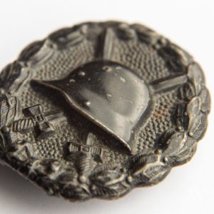 Wound Badge 1918 in black Counter-relief D.R.G.M. mark on the catch hook