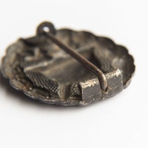 Wound Badge 1918 in black Counter-relief D.R.G.M. mark on the catch hook